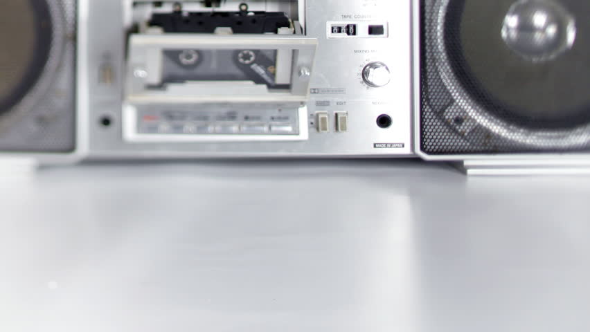 stopmotion of a fantastic looking retro ghetto blaster with cassette tape spilling out 