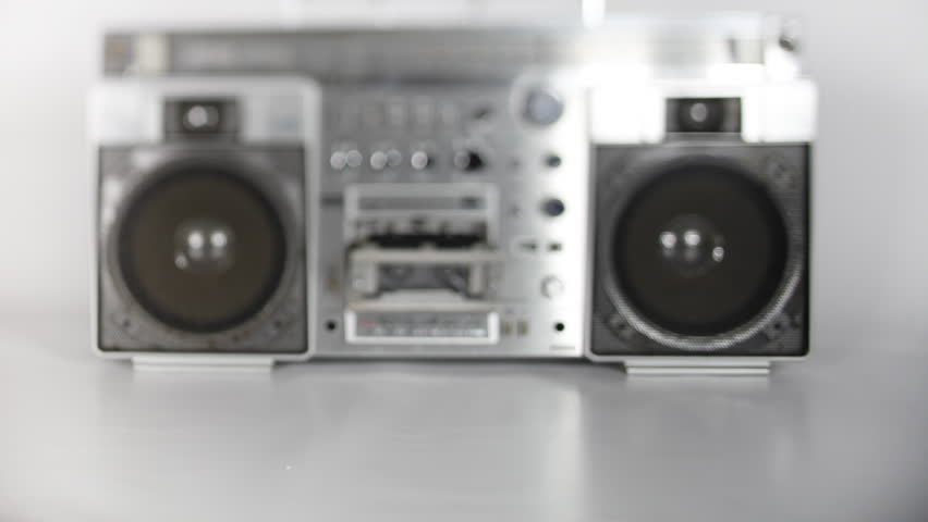 stopmotion of a fantastic looking retro ghetto blaster with cassette tape spilling out 