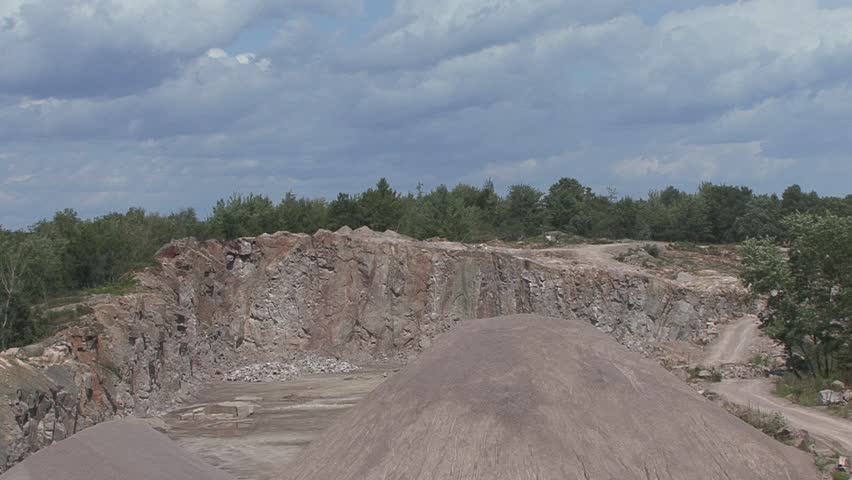 Miners set an explosion at the open pit quarry.