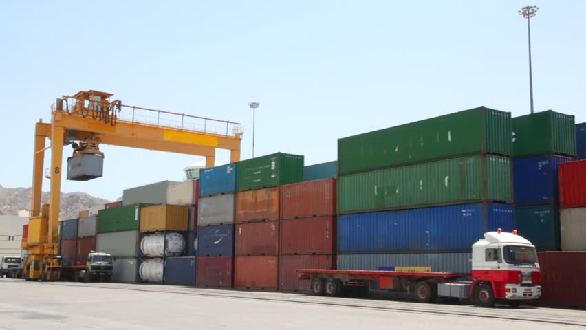 loading of containers with cargo to trucks in seaport