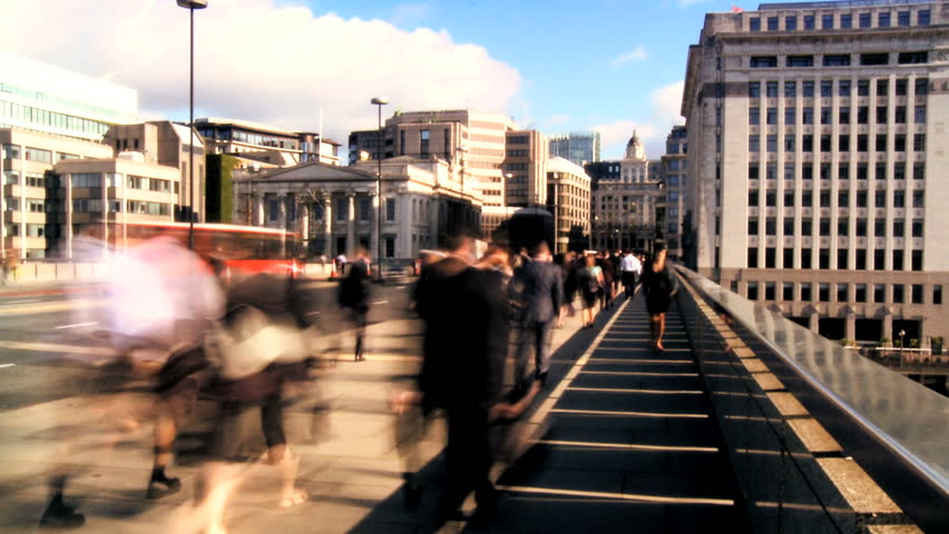 Time-lapse of city streets with morning commuters & traffic