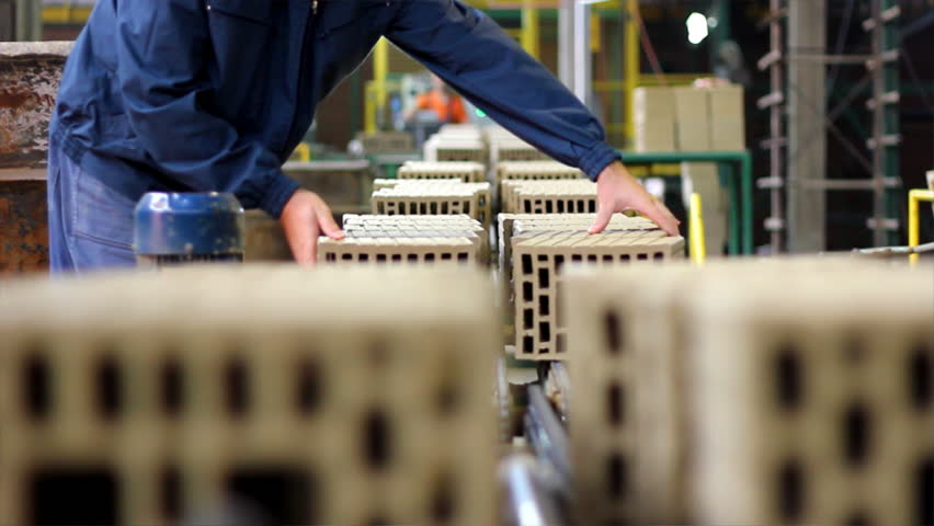 Workers at the factory making blocks and bricks