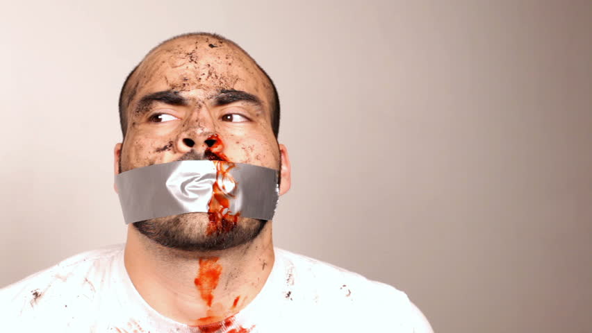 Man in white T-Shirt with Duct Tape on Bloody face