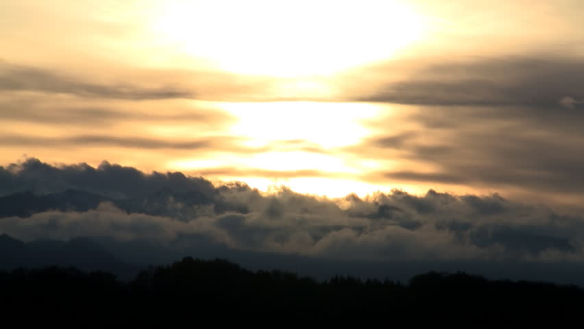 Sunset timelapse behind the Pyrenees mountains in France 