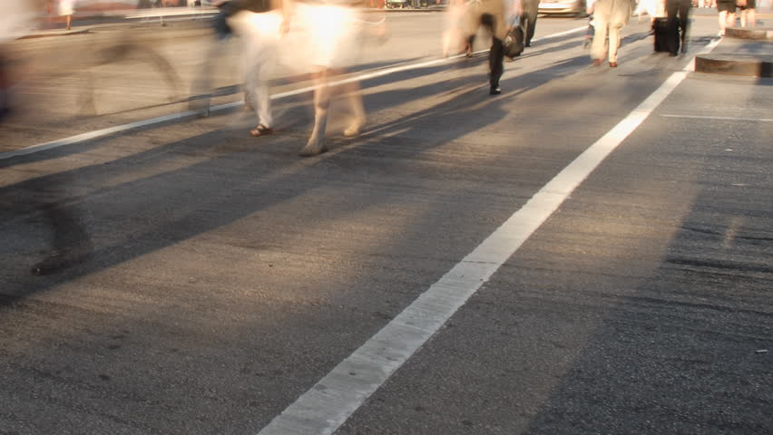 City commuters at crosswalk in rush hour