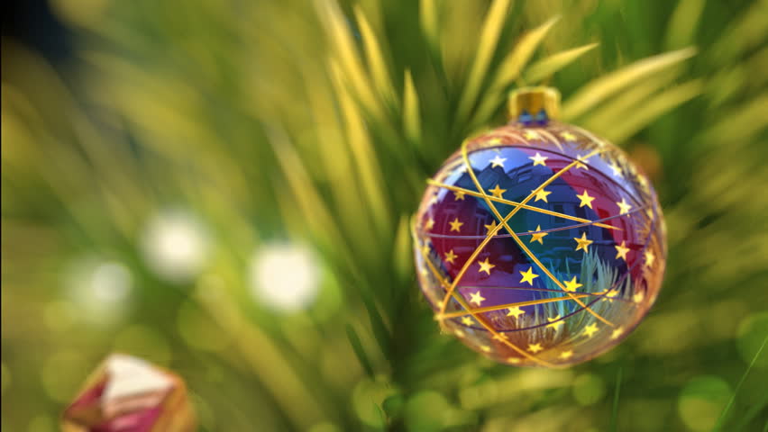 Christmas greeting card with shining christmas tree and small house on background