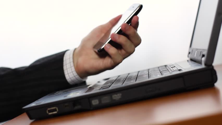 Shopping online using cell phone and laptop