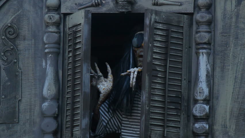 A skeleton peaking out of the pirate ship. 