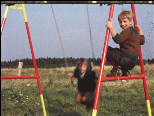 Children on swing (vintage 8 mm amateur film)