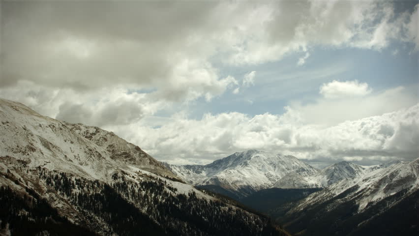Early Snow Storm Mountain Pass Colorado, LOOPING! Great for themes of nature, travel, wilderness, seasons, weather, mountains, exploration, outdoor recreation, adventure.
