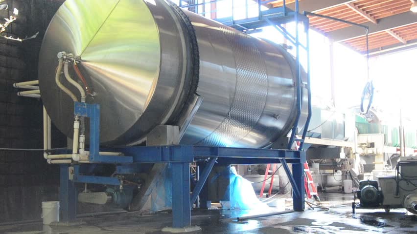 A large spinning wine vat mixing a brew