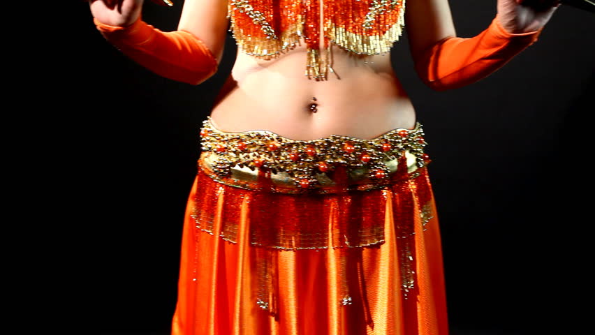 woman dancing in traditional arabic costume with sabre