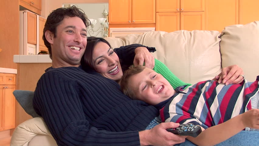 Family spending time together watching television