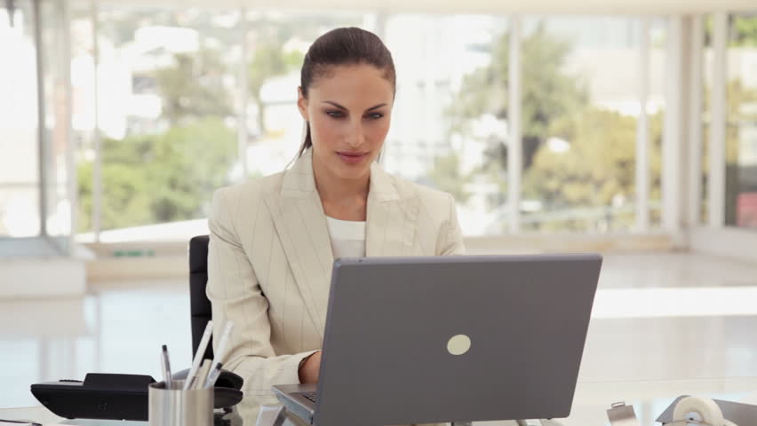 Businesswoman Using a Phone at the Office