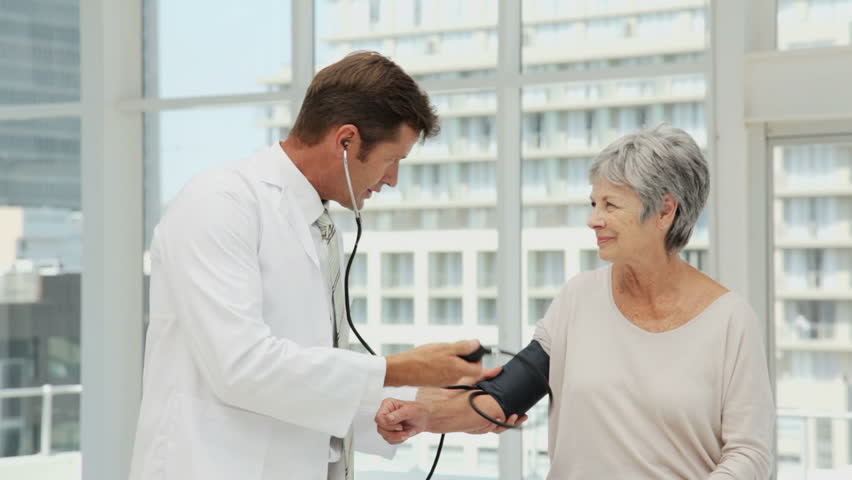 Doctor Checking Blood Pressure of a Senior Woman