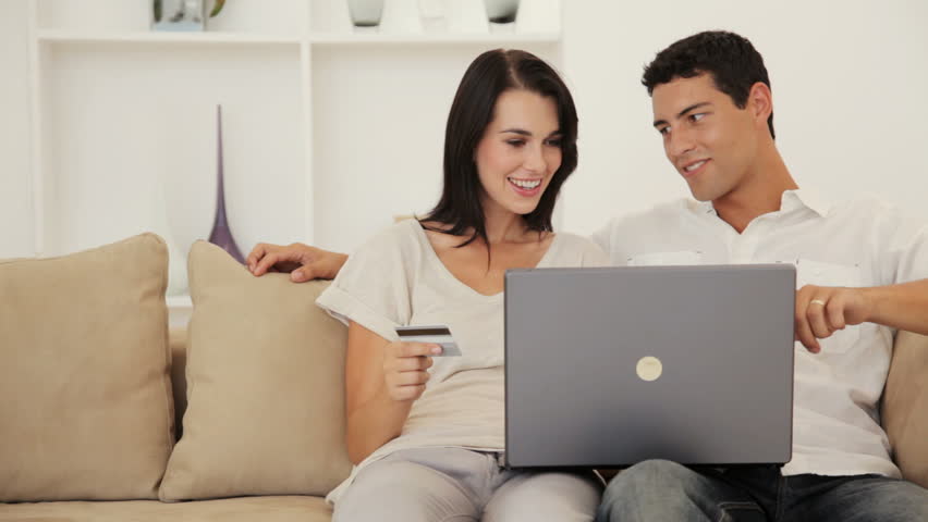 Young Couple Sharing a Laptop