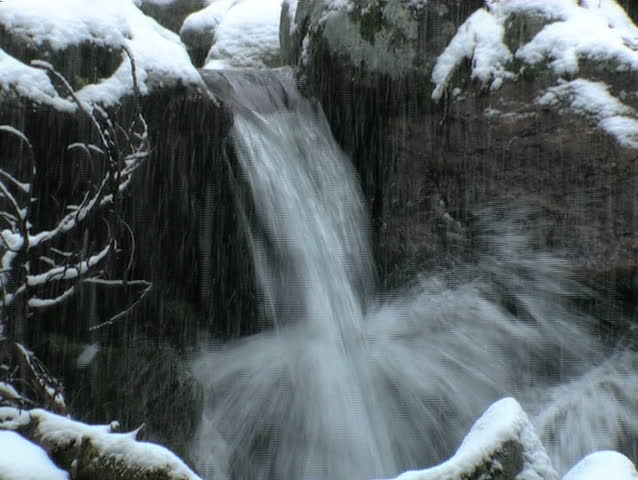 frozen waterfall covered with snow