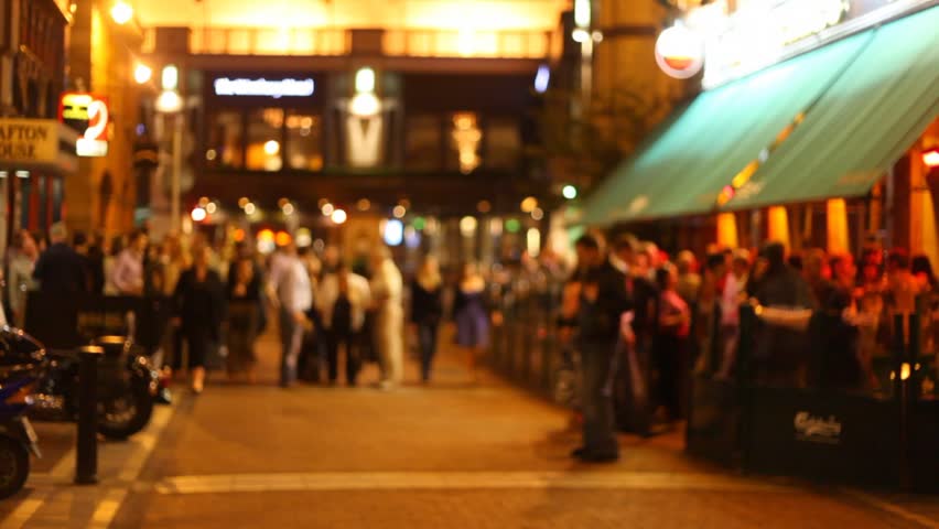 Defocused people walking in the streets of Dublin during the evening 