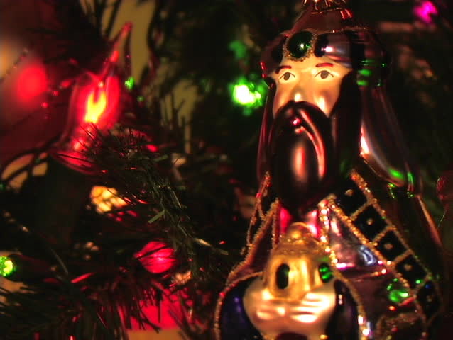 ORNAMENT HANGING ON A CHRISTMAS TREE DEPICTING ONE OF THE THREE WISE MEN.