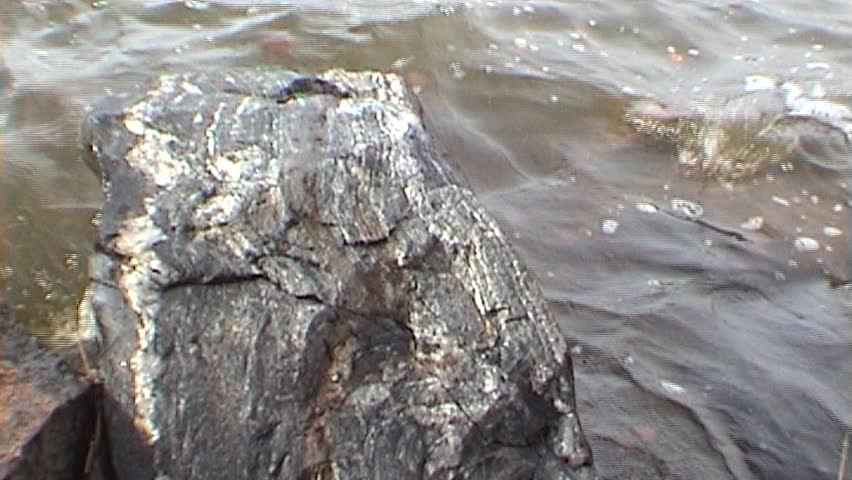 Texture of the rock and water, tripod, 16x9