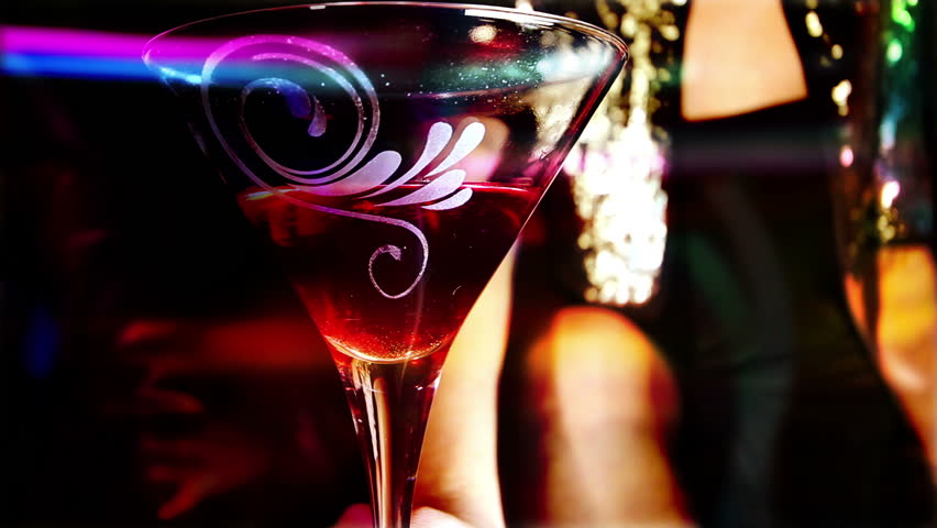 beautiful classic pinup girl in a VIP club drinking a cocktail