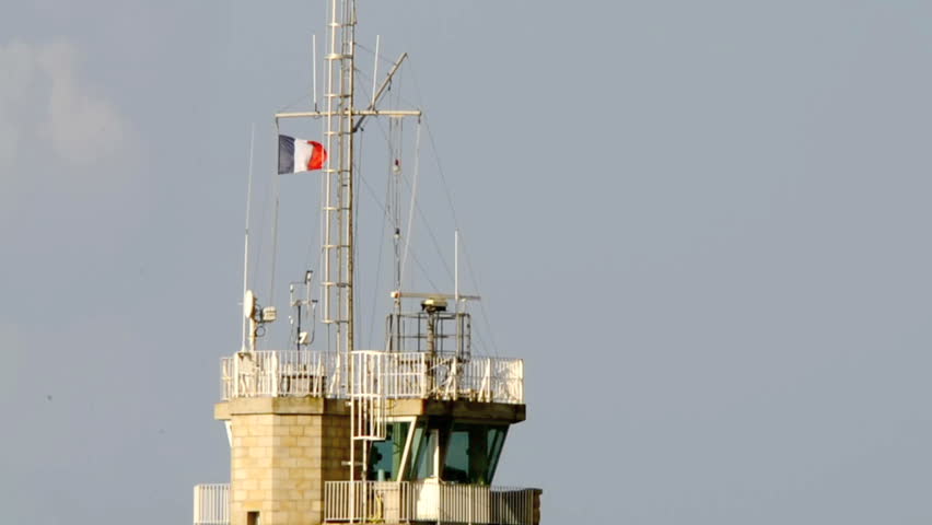 Lighthouse on a sunny day at the Pointe du Pontusval in Kerluon, Brittany, France.