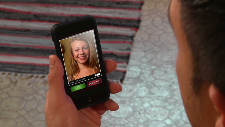 Female video chatting on a generic, portable handheld device.  Screen images simulated. (E)
