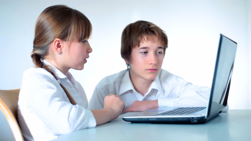 Children working at a laptop