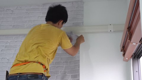 1000 Man Hanging Wallpaper Stock Clips And Footage Royalty Man Hanging New Wallpaper On A Wall Improving Home With Skill And Keep Details Good