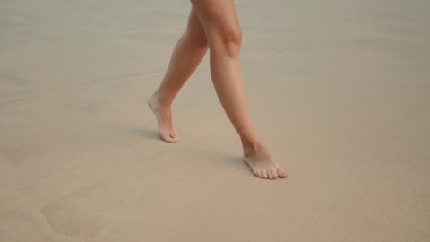 White Bikini Beach Girls Topless - Woman legs walking on the beach sand waves sea