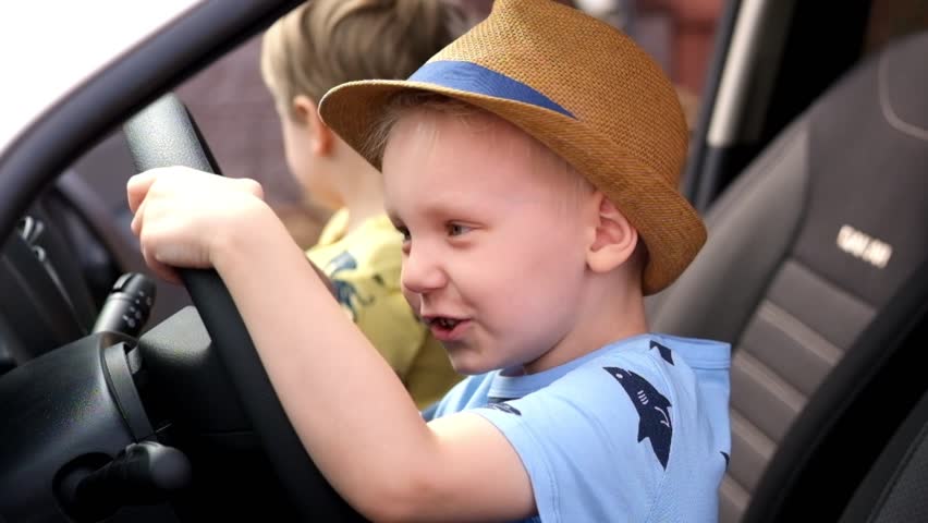 little boy driving