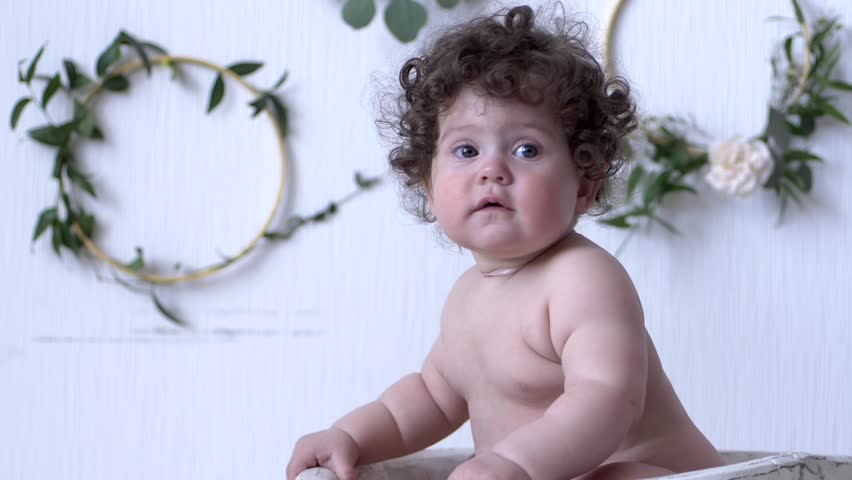 Hd00 19child Photo Session Small Girl With Curly Hair Sits On
