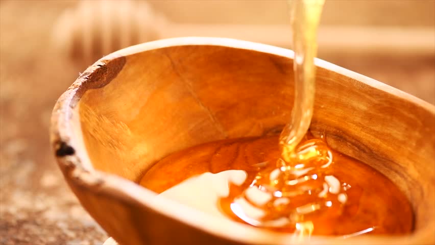 pouring-honey-on-spoon-and-bowl-image-free-stock-photo-public