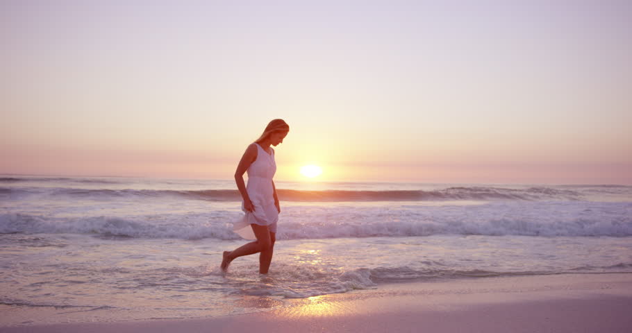 Girl in a white dress walking on the beach images Girl in a white dress walking on the beach images