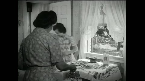 Circa 1950s A Woman Sends Her Teenage Daughter Next Door With A Lunch Basket For The Neighbors Who Are Still Moving In