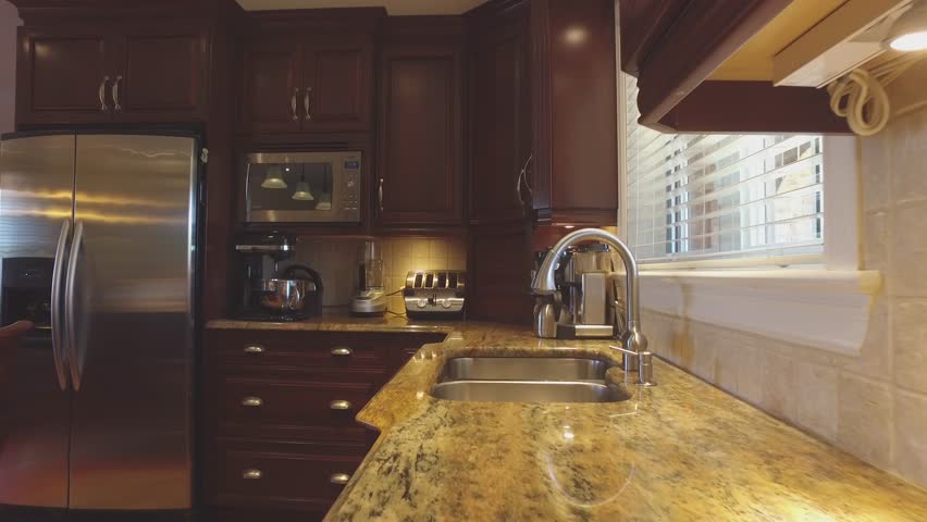 High End Kitchen Slider Along Granite Counter Tops