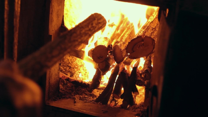 Working The Furnace In The Potbelly Stove Toned