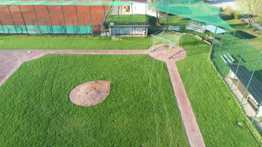 Panning And Ascending View Over Beautiful Green Baseball Field In
