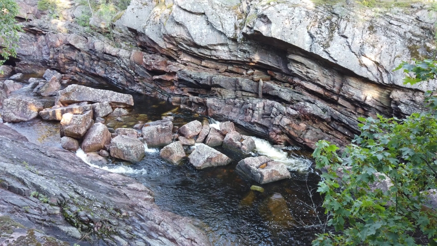 Rapidly flowing water cascading down rocks image - Free stock photo ...
