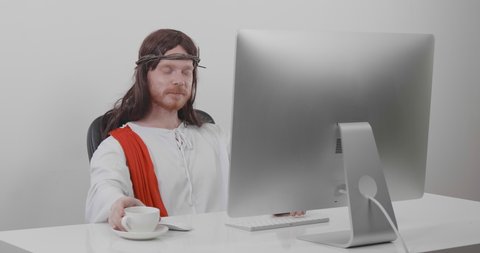 Pensive Jesus Sitting At Desk Stock Footage Video 100 Royalty