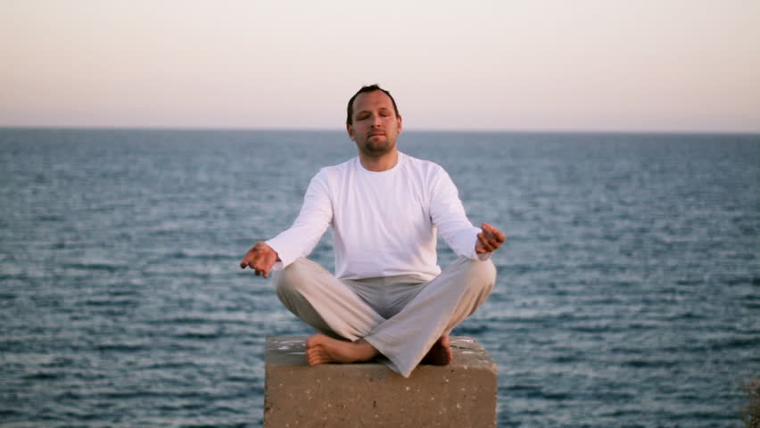 Man Meditating By The Sea Stock Footage Video 1034692 | Shutterstock