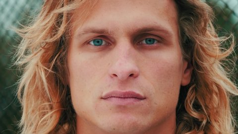 Portrait Of Handsome Blue Eyed Guy With Blond Long Curly Hair