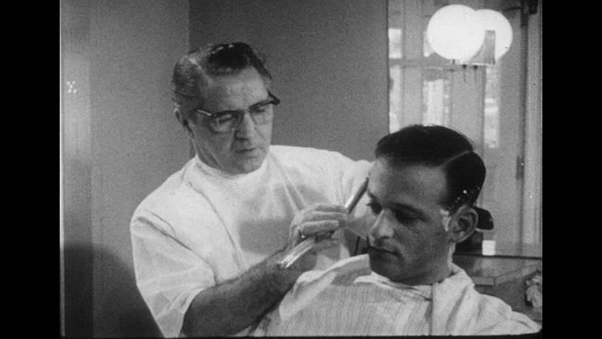 Stock Video Clip of UNITED STATES 1950s: Barber shaves man 