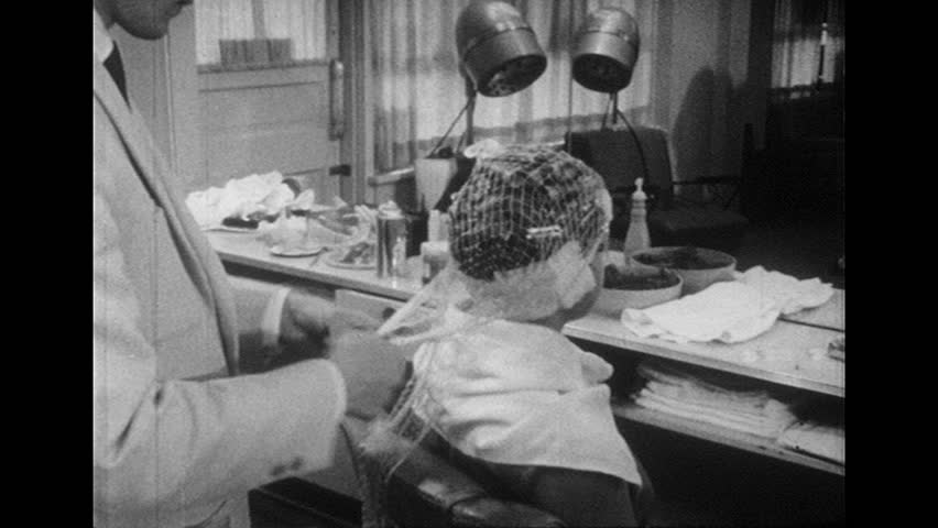 UNITED STATES 1960s: Woman Wearing Hair Dryer Cap. Stock  UNITED STATES 1960s: Woman Wearing Hair Dryer Cap. Stock