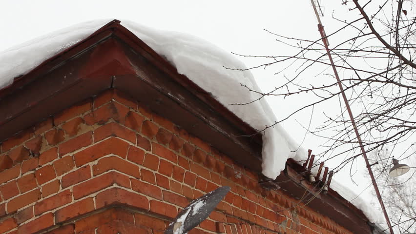 Cleaning Snow From Roof Eaves Stock Footage Video 100 Royalty