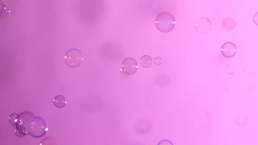 4k00 16a Lot Of Blue And Clear Soap Bubbles Isolated On Light Pink