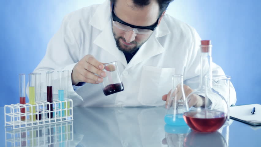 Male Scientist Mixing Chemicals In Beaker Stock Footage Video 1126717 ...