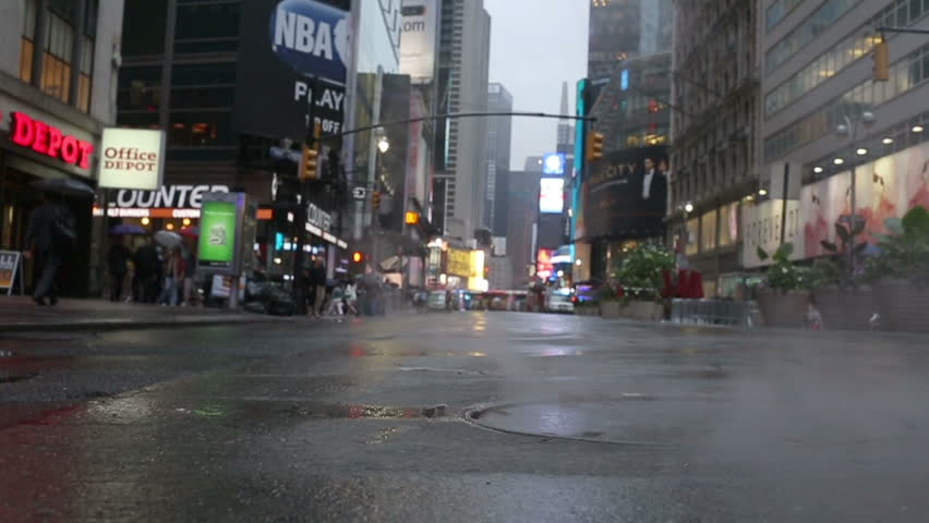 NEW YORK - MAY 24, 2012: Steamy Sewer Cover And Puddle In Rain Street ...