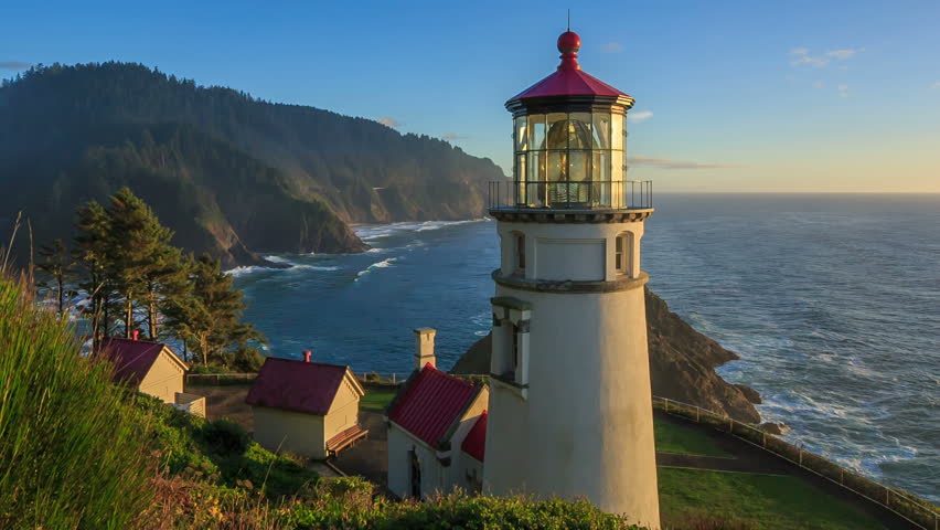 Along The Oregon Coast Stands The Heceta Head Lighthouse, Lit Up At ...