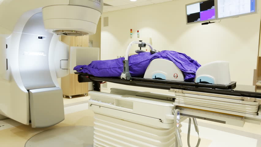 Patient Getting Radiation Therapy Treatment Inside A Large Radiotherapy ...